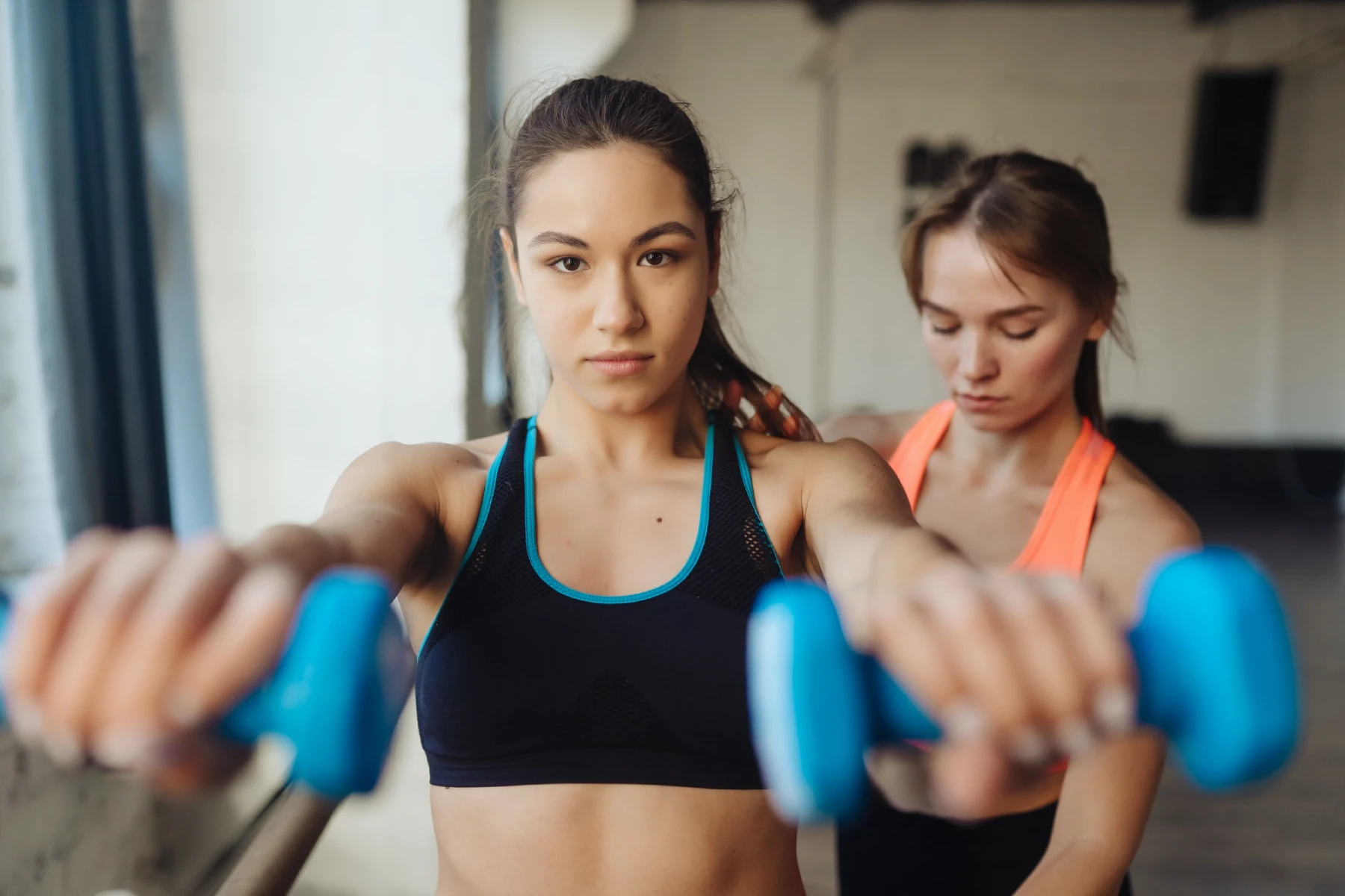 Young Woman Personal Trainer Helping With Workout
